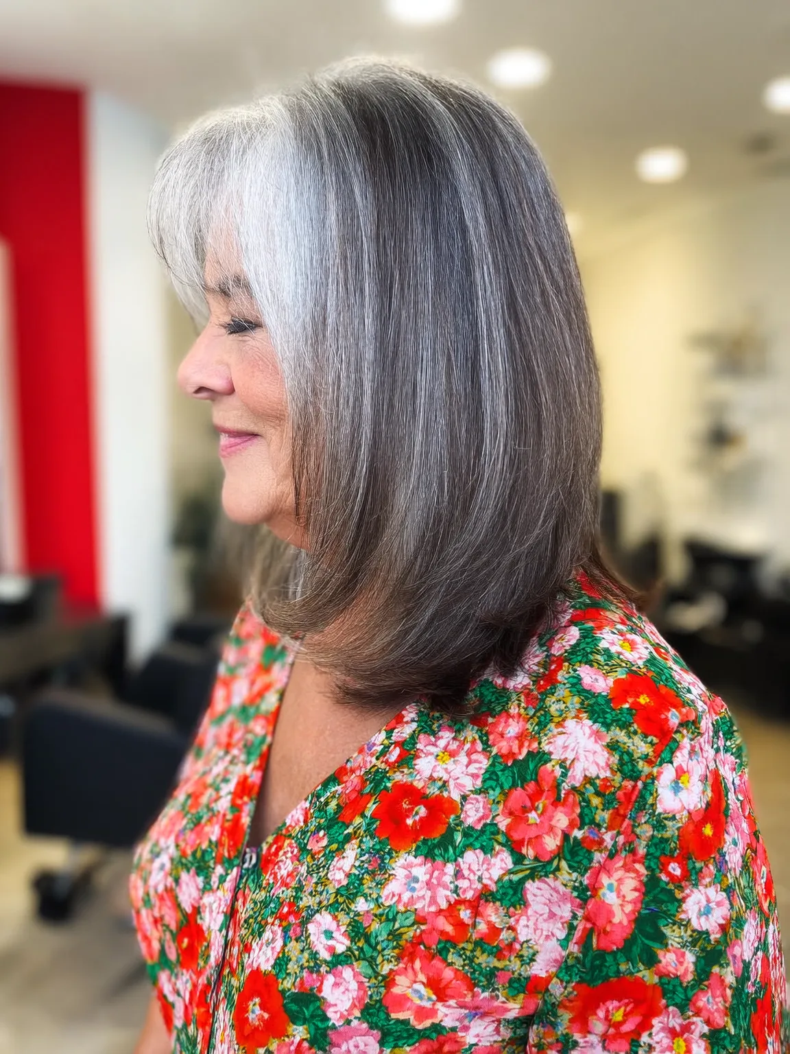 Silver and Gray Long Bob with Side-Swept Bangs on Round Face